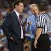 Kansas head coach Bill Self looks on at Michigan head coach John Beilein speaks with a referee during the first half at Cowboys Stadium in Arlington, Texas on March 29, 2013. Melanie Maxwell I AnnArbor.com